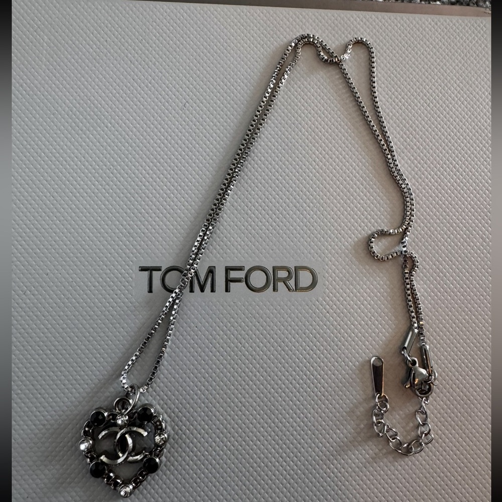 Chanel charm on silver Chain with silver and black details